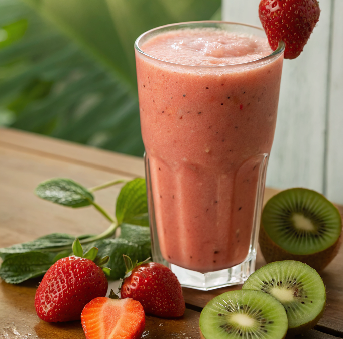 Kiwi Quencher Tropical Smoothie in glass with fruits