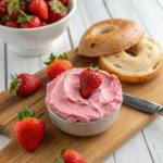 strawberry cream cheese spread on bagel